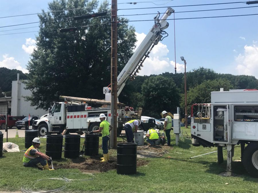 AEP crews work on the damaged power line Tuesday afternoon.