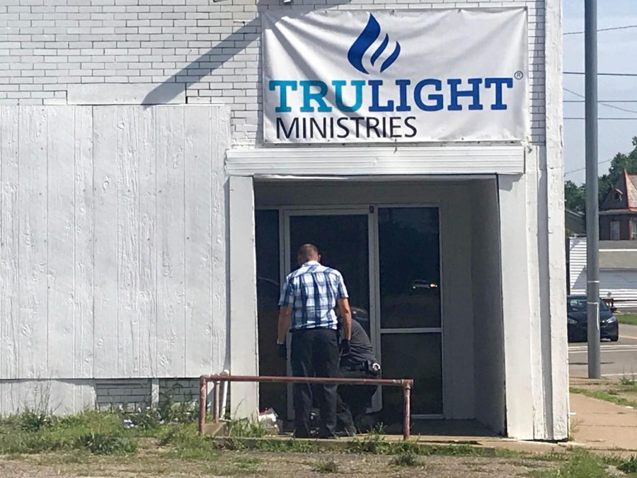 Police detectives investigate fatal stabbing. The detectives were seen collecting evidence in the doorway of Trulight Ministries on Putnam Avenue.