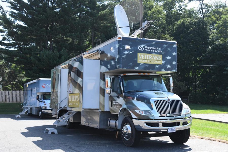 Two mobile VA clinic units are parked outside the VA Zanesville Clinic to primary care patients while flood repairs are made inside the clinic.