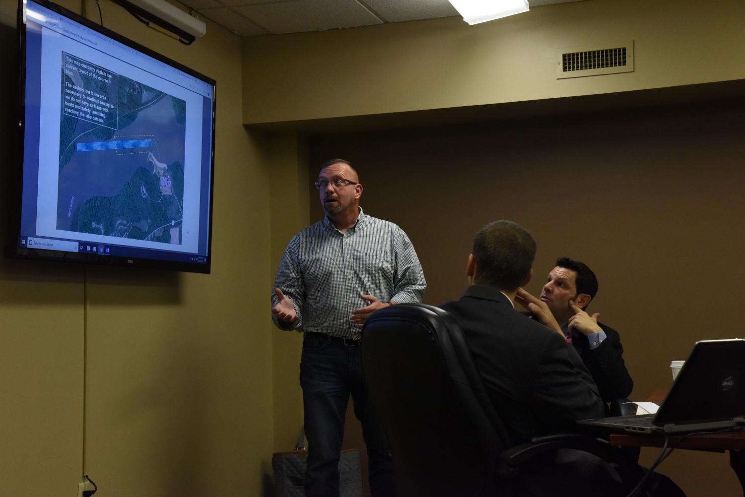 Cliff Hecker presents the outline for plan one of the potential dredging project that is the most essential change that needs to be made. He presents in front of Matt Previts (front) and Matt Baldino (back).