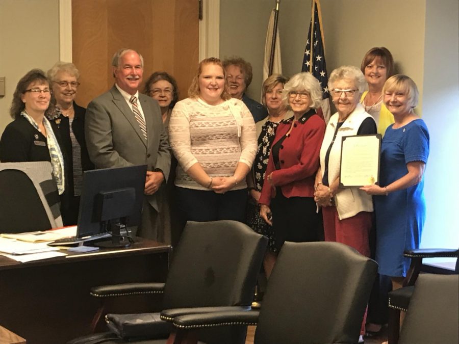 The Muskingum County Commissioners pose for a photo with members from the Muskingum County chapter of Daughter of the American Revolution.
