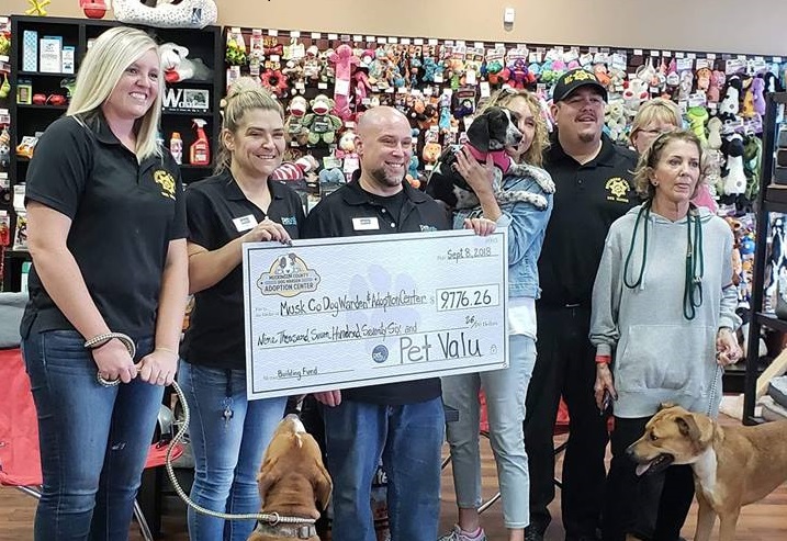 PetValu Store Manager Shane Cooper presents a check for $9,776.26 to wardens and volunteers of the Muskingum County Dog Warden and Adoption Center. Photo provided by Shane Cooper.