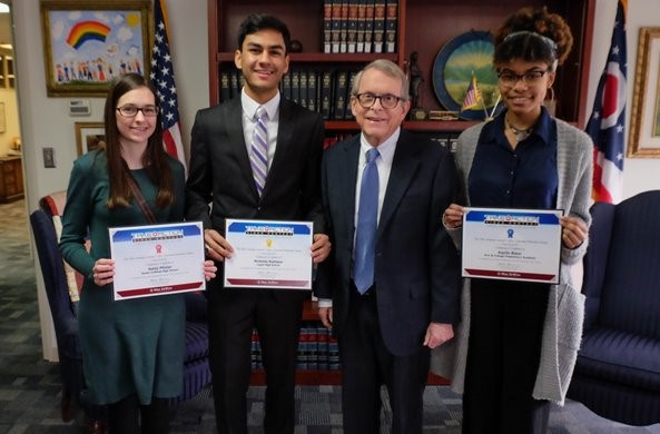 Mike DeWine poses with the top three winners of the 2017 Take Action Scholarship Contest. Photo from the Ohio Attorney General’s website.
