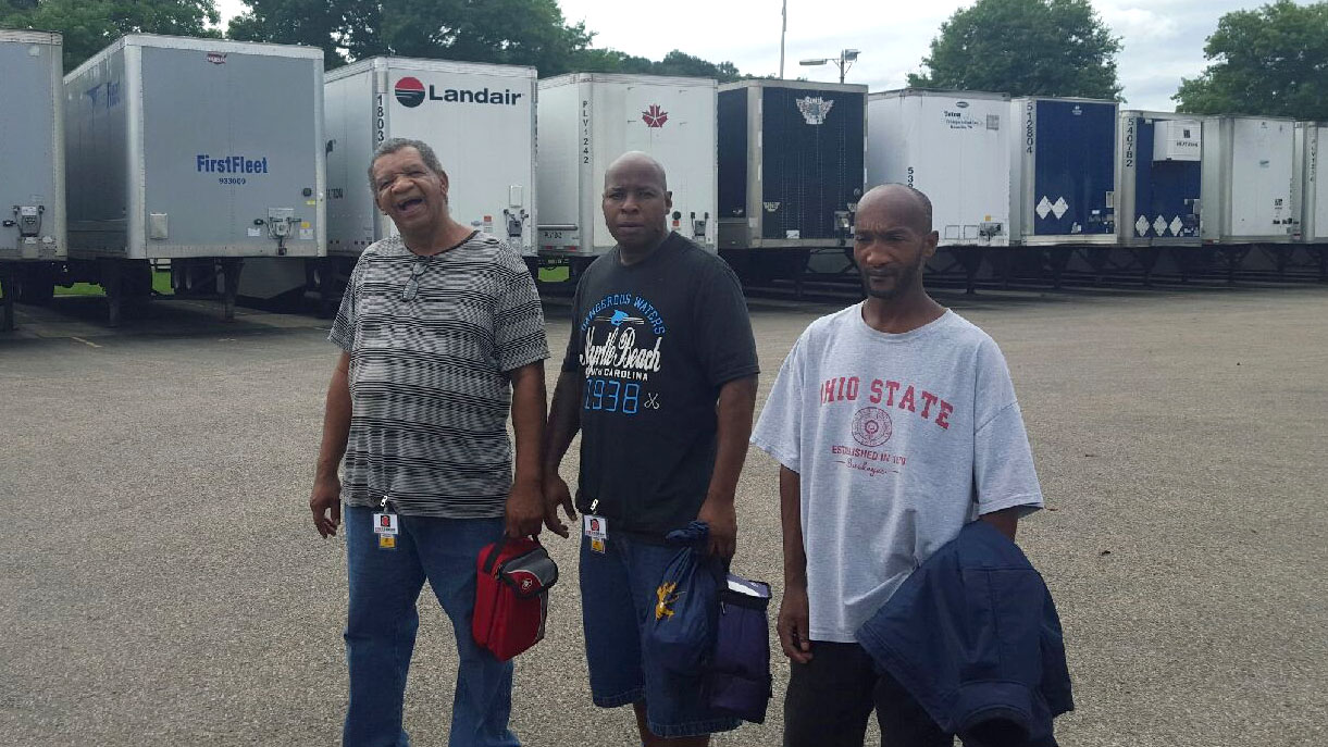 The first three participants in Trulight Ministries' new work partnership with Inergoup pictured on their first day at NFI Industries.