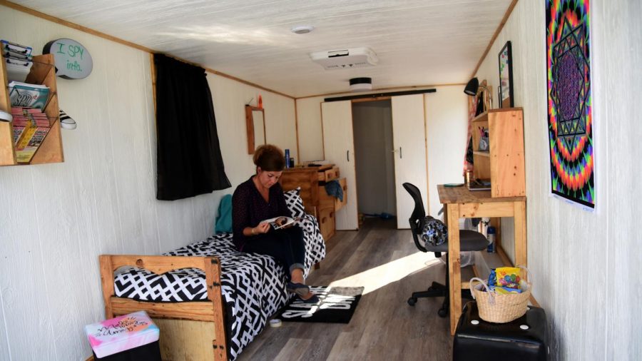 Ronelle Barnett sits on the bed inside the new I Spy Room trailer. The trailer was renovated by inmates and maintenance workers at Noble County Correctional Institute.