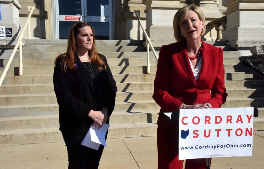 Betty Sutton (right) speaks outside the Muskingum County Courthouse Tuesday morning accompanied by Amber Daniels (left).