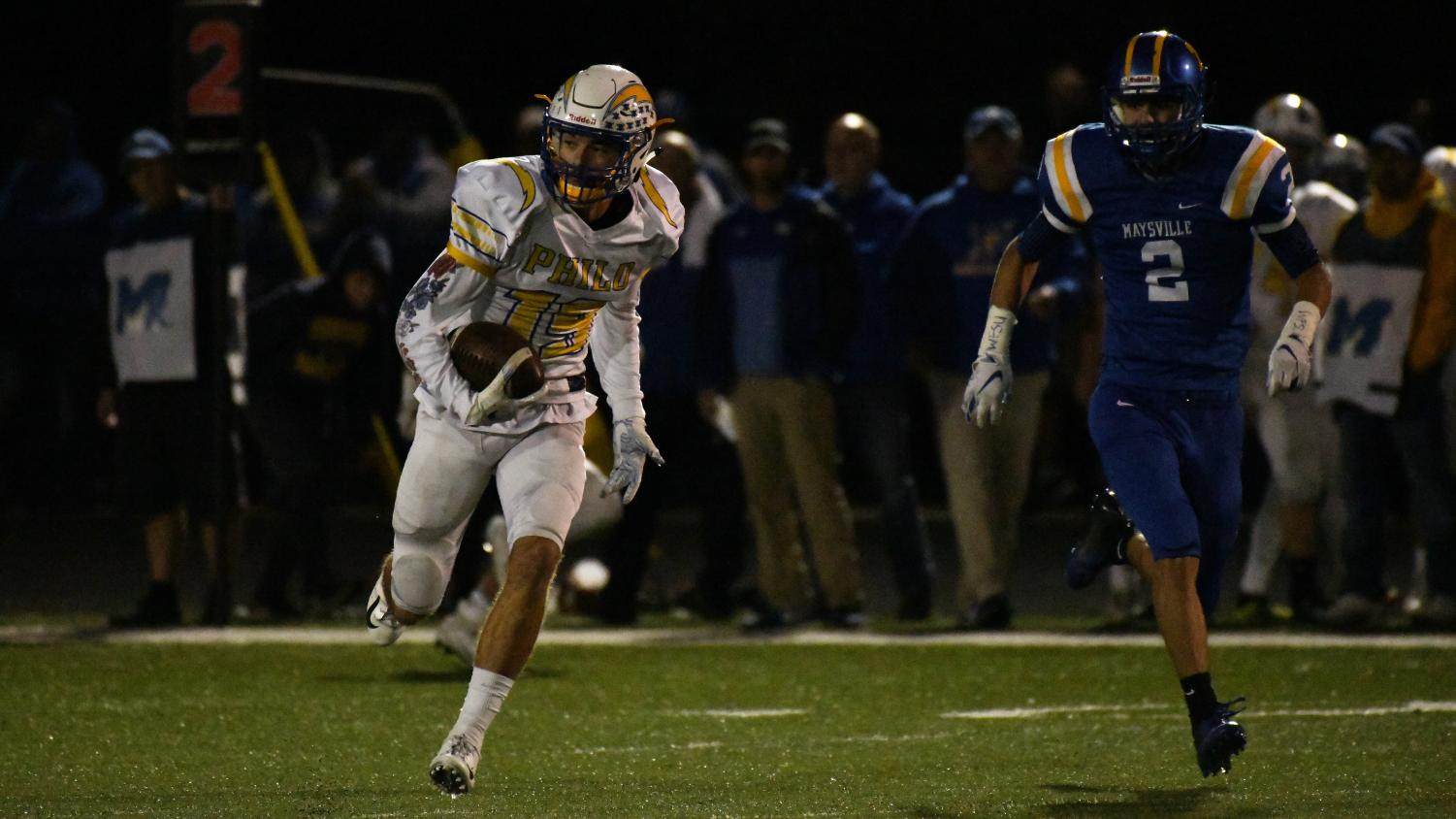 Philo wide receiver Carson Stottsberry looks for space to run against Maysville defender Quentin Stottsberry. The Philo receiver played a crucial part in the teams win.