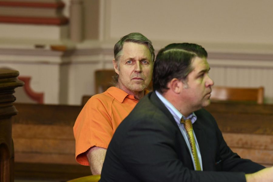 John Kemp looks in the direction of the photographers before pleading guilty to his crimes on Oct. 17.