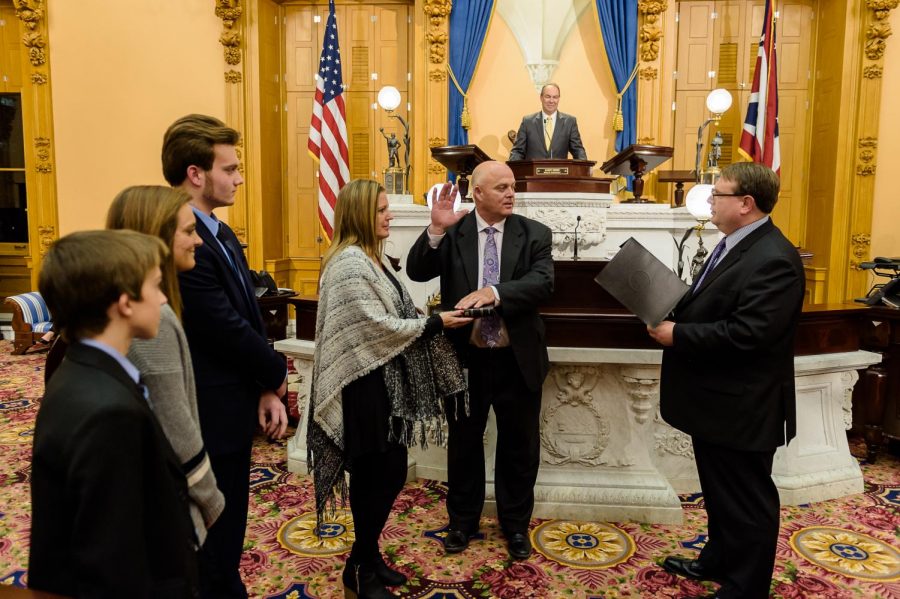 Brian Hill, joined by his family, is sworn into Ohios 20th District Senate Seat.