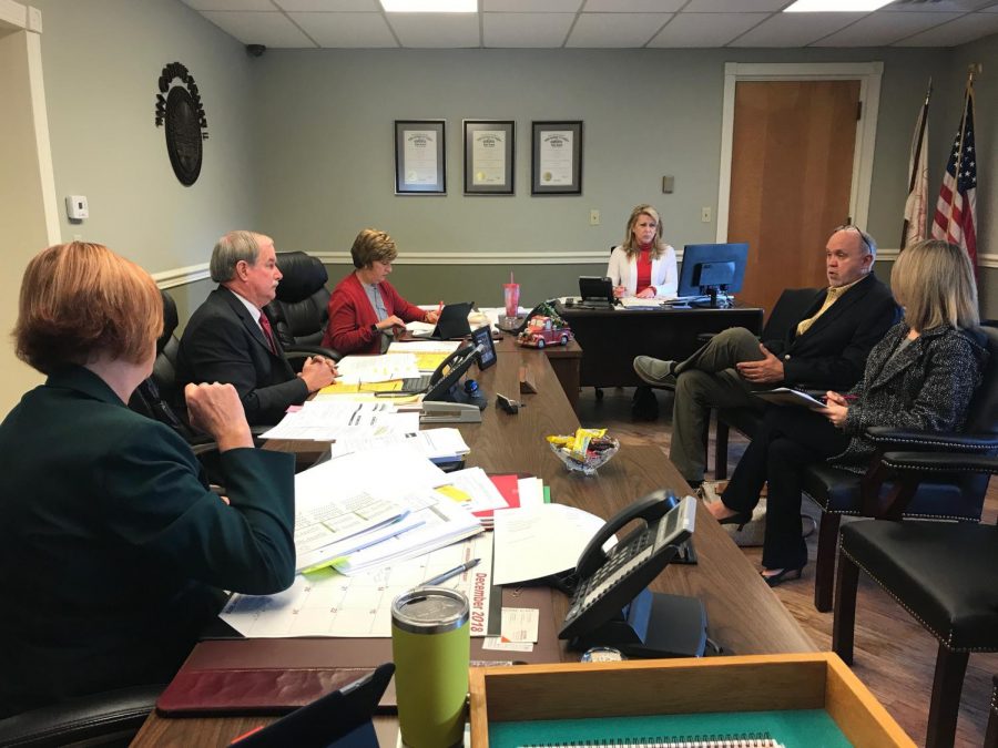 Dr. Charles Feicht and a member of his staff meet with the Muskingum County Commissioners Monday morning.