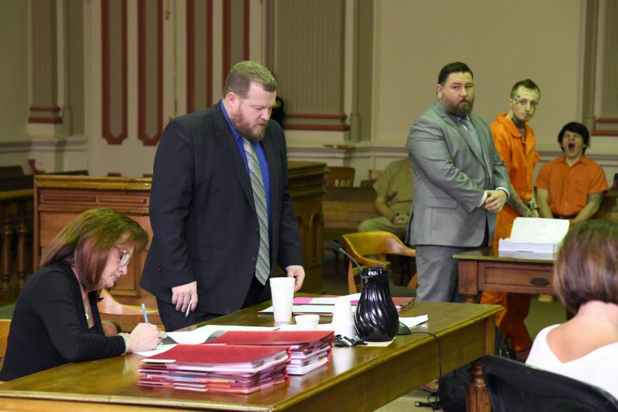 Brandon Spring stands in court with his defense attorney during Assistant Prosecuting Attorney John Litles presentation of the Springs case to the court.