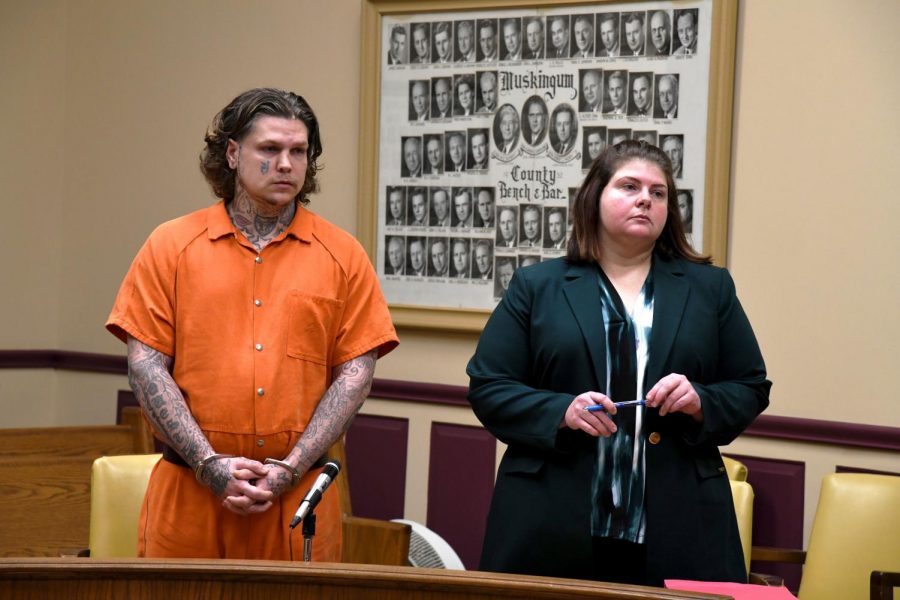 John Hampton stands beside his defense attorney, Kendra Kinney, for his sentencing on Jan. 17.