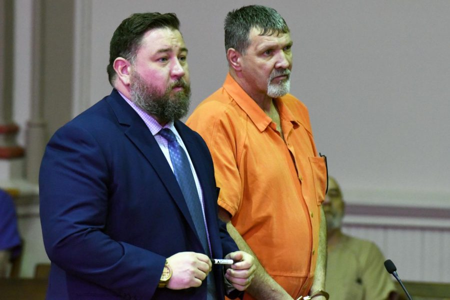 Robert Richmond stands in the Muskingum County Court of Common Pleas with his attorney, Terry Rugg, during his arraignment on Jan. 16.