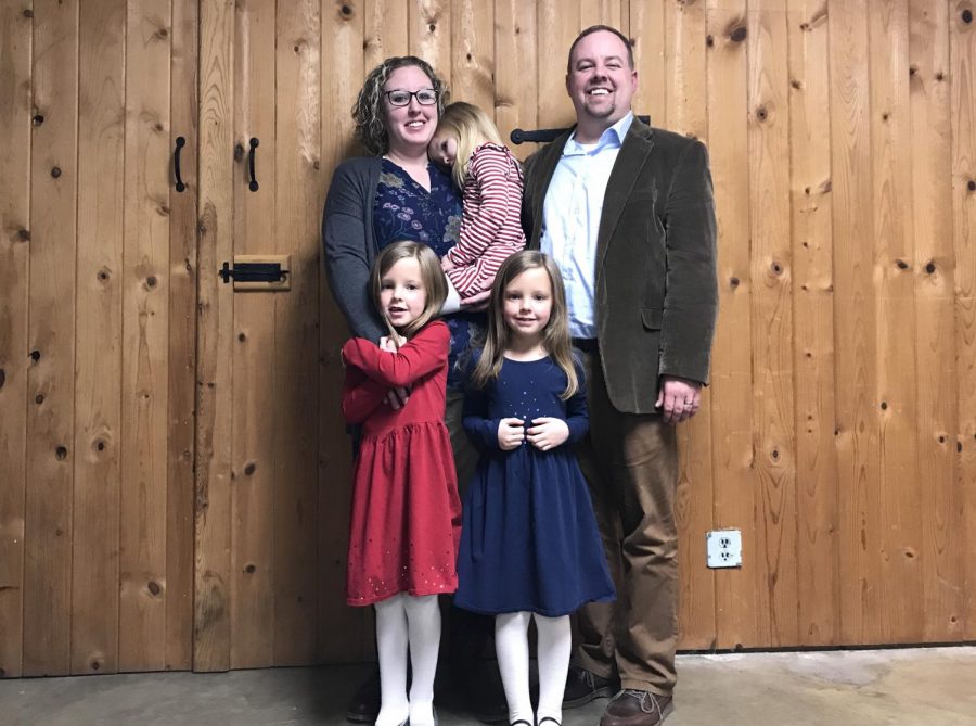 Kristi (KJ) Kearns poses for a photo with her husband and their three daughters following her first meeting as a member of the New Concord Village Council on Feb. 11.