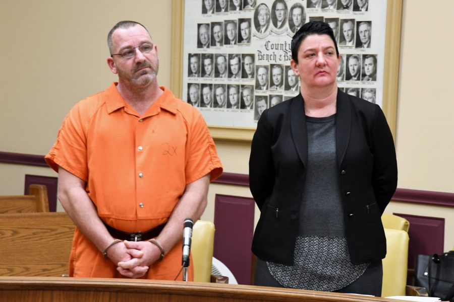 Travis Pletcher (left) stands with his defense attorney Nicole Churchill (right) in the Muskingum County Court of Common Pleas to reverse his former plea of not guilty.