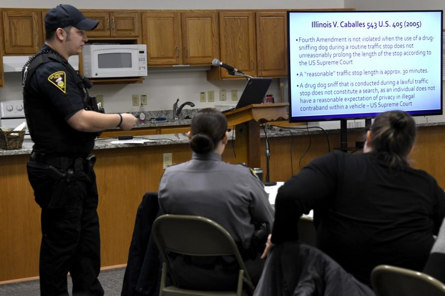 New Concord Police Officer Jeffrey Traub presents about the Supreme Court case Illinois vs Caballes in regards to fourth amendment rights during the New Concord K-9 community meeting on Tuesday, Feb. 19.