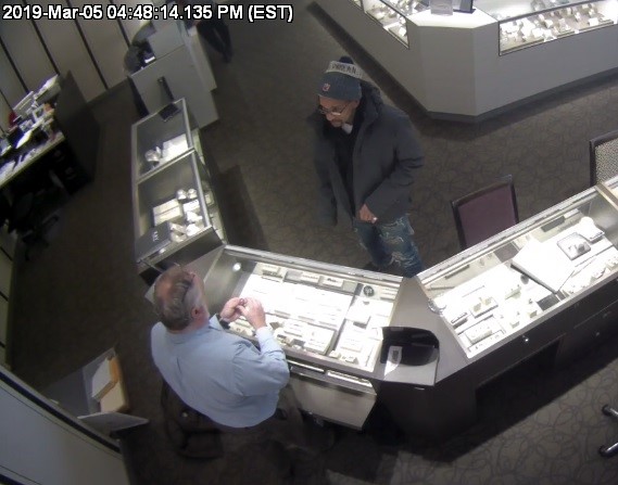 The man accused of stealing merchandise from Kays Jeweler is seen on camera while inside the store. Photos provided by the Zanesville Police Department.