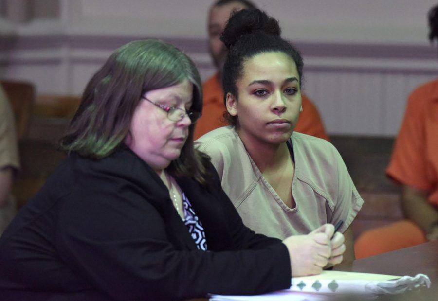 Brianna Dotson sits alongside her defense attorney, Amy Otto, while the state presents the facts of the case.