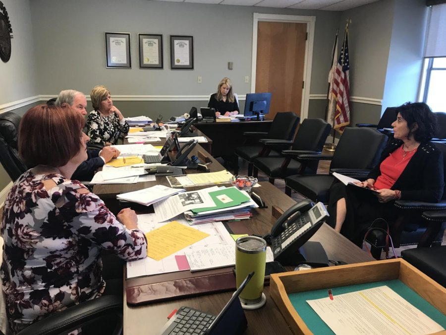 Danielle Mason, Eastern Regional Director for the Ohio Attorney Generals Office, meets with the Muskingum County Commissioners Thursday morning.
