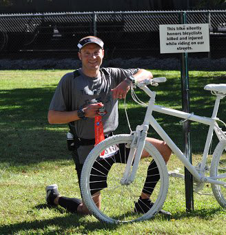 Brad Hollingsworth with the Ghost Bike | photo provided by Zane State College