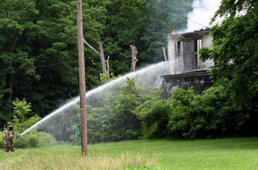 Firefighters fighting the blaze at 160 Dresden Adamsville Rd. were instructed to stay on the outside of the structure as it was too hot to send anyone into the vacant home.