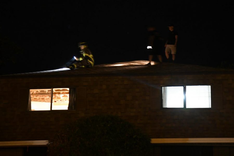 Firefighters inspected the roof of the apartment for holes that could have been allowing water into the ceiling area.