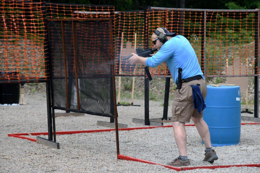 A+USPSA+range+officer+shoots+his+way+though+a+stage+at+Briar+Rabbit+on+Friday%2C+May+31.