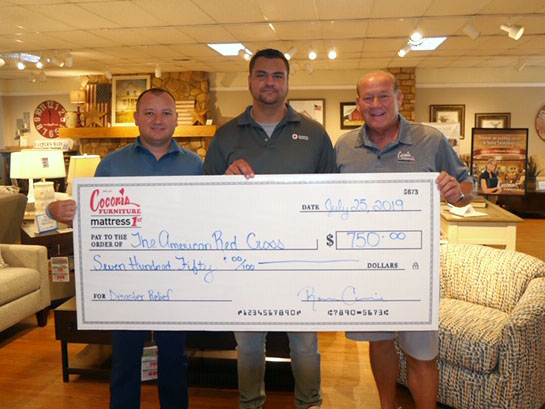 The Coconis family presents a check of $750 to the American Red Cross. Pictured left to right are Bo Coconis, Red Cross Executive Director Matthew Riddle and Randy Coconis. 