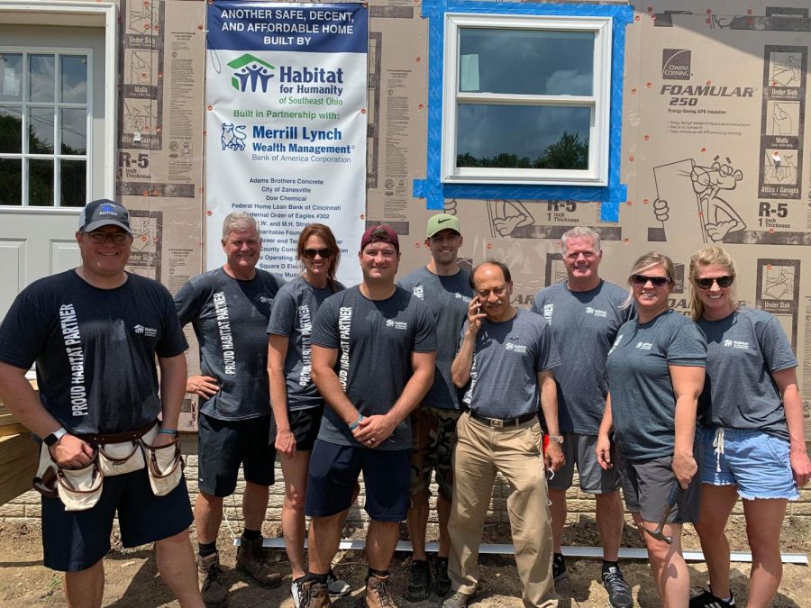 Volunteers complete a day of work with Habitat for Humanity on Mead Street. 