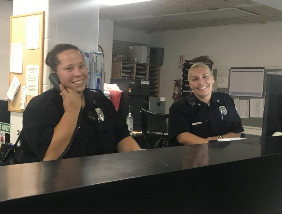 Corrections officers Roessler and Jones at the front desk of the jail. 