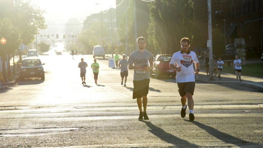 Runners Cameron Godfrey and Daniel Barr head toward the finish line during the 2018 5K race. 