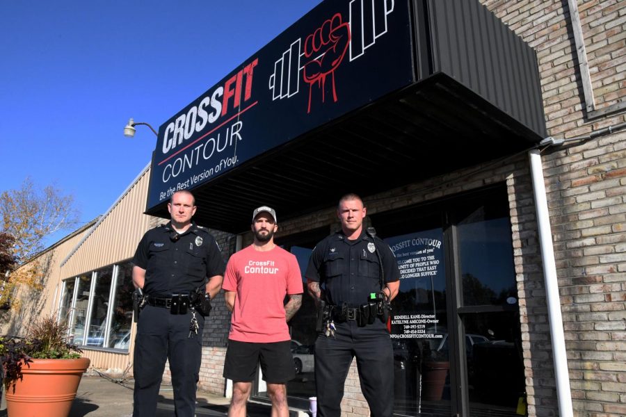 CrossFit Contour Coach Kendall Kane (center) has volunteered his gym and equipment for the Nov. 2 event organized by Zanesville Police Department Patrolmen Ryan Harris (left) and Bryan Wolfe (right).