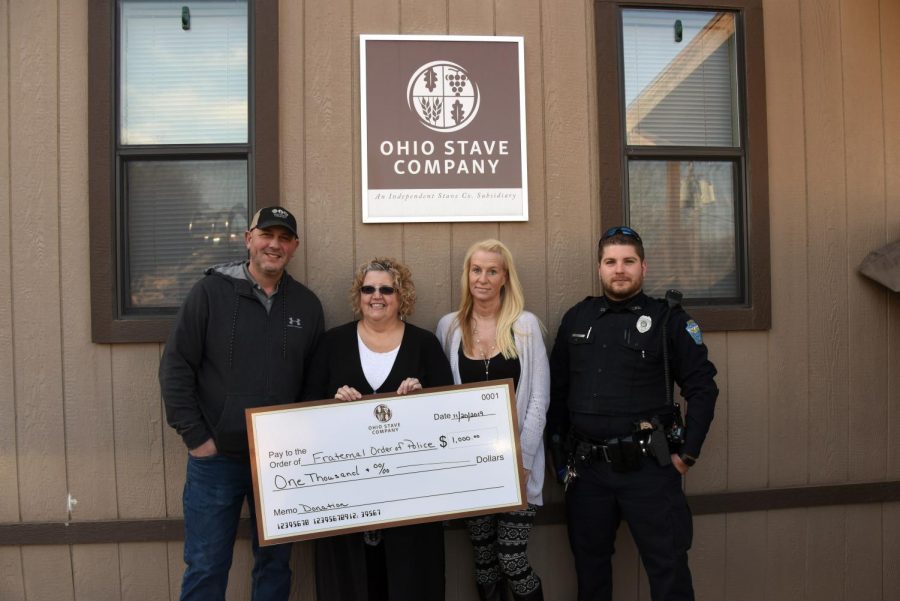 From left to right: Jerry Williams, Ohio Stave Mill Manager and Office Manager Kelly Price present FOP President and Muskingum County Deputy Brandi Seckman and FOP member and Zanesville Police Officer Briar West with a check for $1,000.