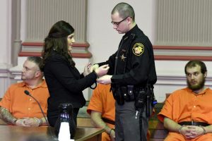 Michaela Jones was handcuffed following her sentencing hearing as she remained in the custody of the Sheriff's Office before her transport to prison.