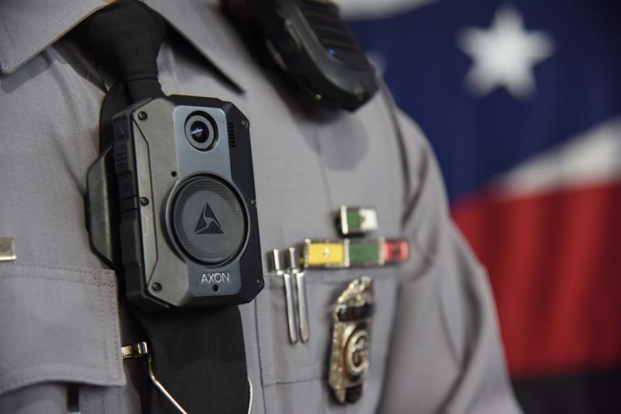 Ohio State Highway Patrol Sergeant Brice Nihiser displays one of the agencys new Axon body cameras.
