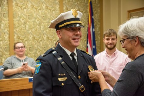 Comstock recently sworn in as chief surrounded by family, friends and coworkers