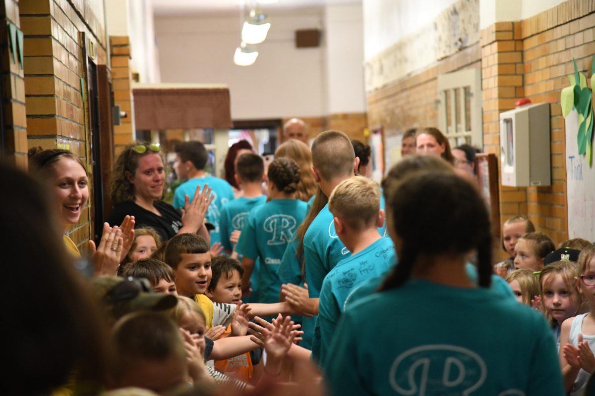 Keene Elementary 6th graders walk through the hall of their building for the final time, they will be the last students ever to have attended every grade at the century-old structure.
